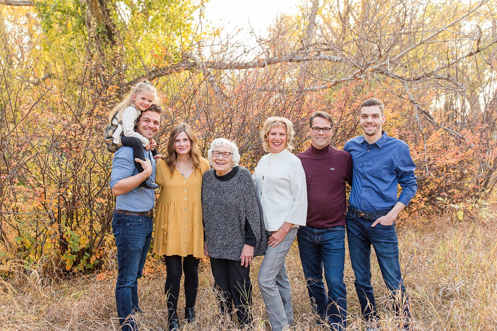Extended family session with a child in the fall in Moose Jaw, Saskatchewan