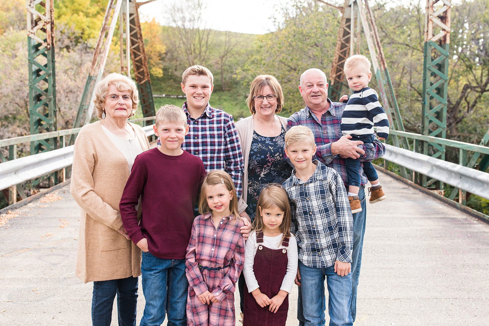 Extended family session with grandparents and their grandkids on a bridge in Moose Jaw, Saskatchewan