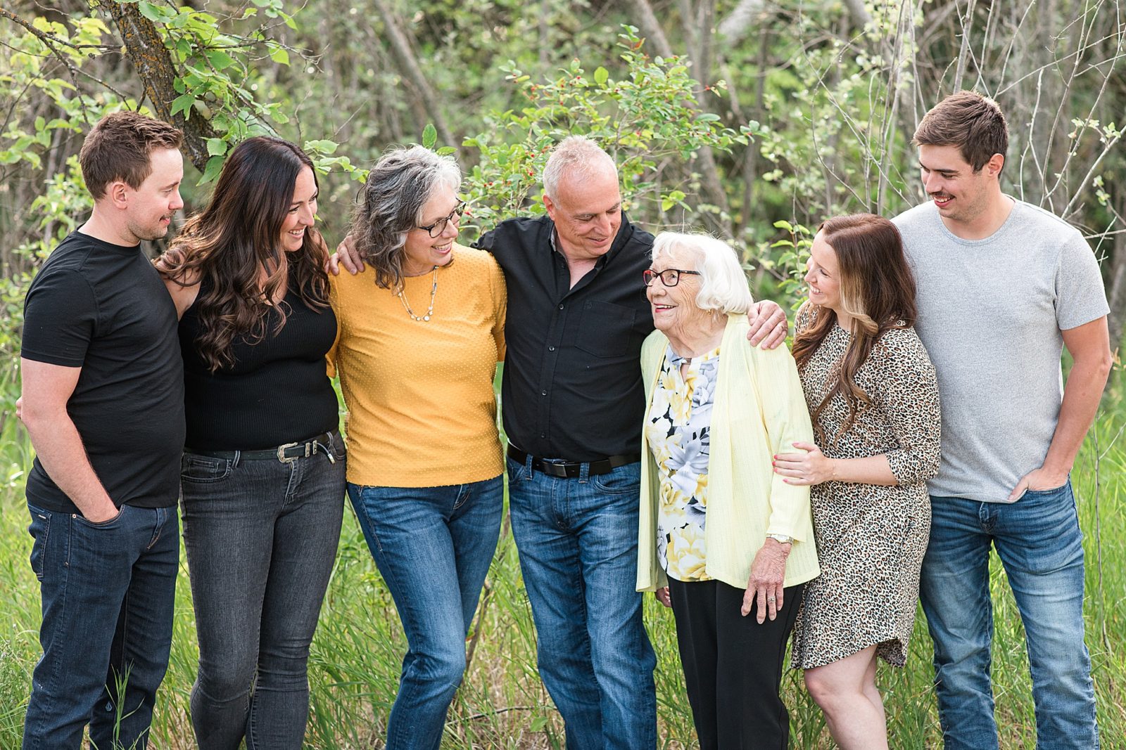 Family looking at a grandma at their family session.