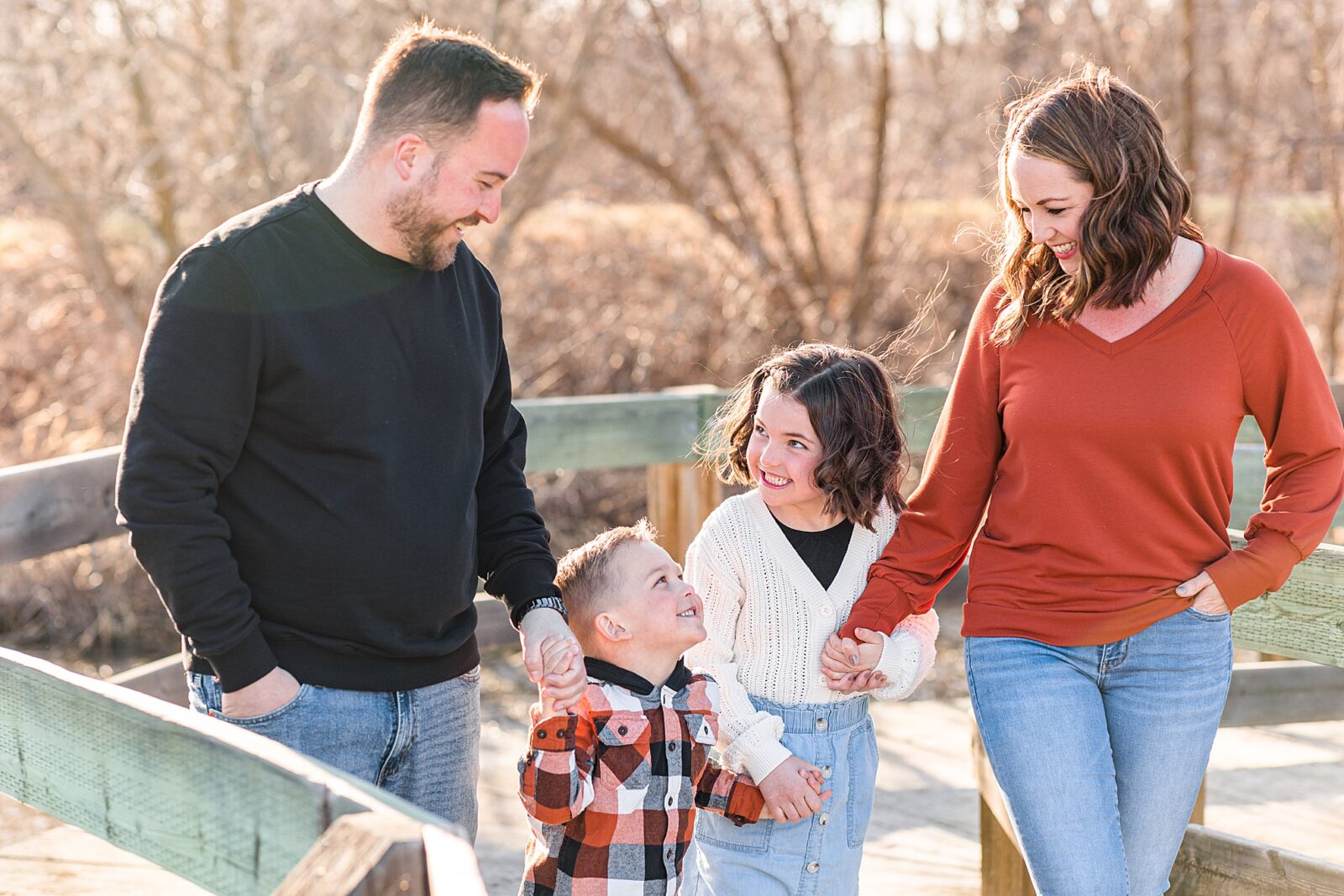 Moose Jaw Spring Family session on boardwalk laughing
