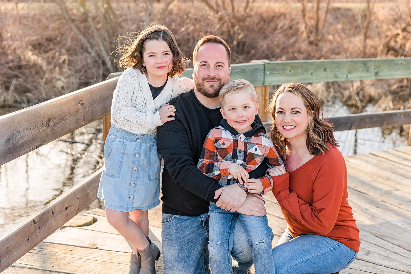 Moose Jaw Spring Family session on boardwalk looking at camera