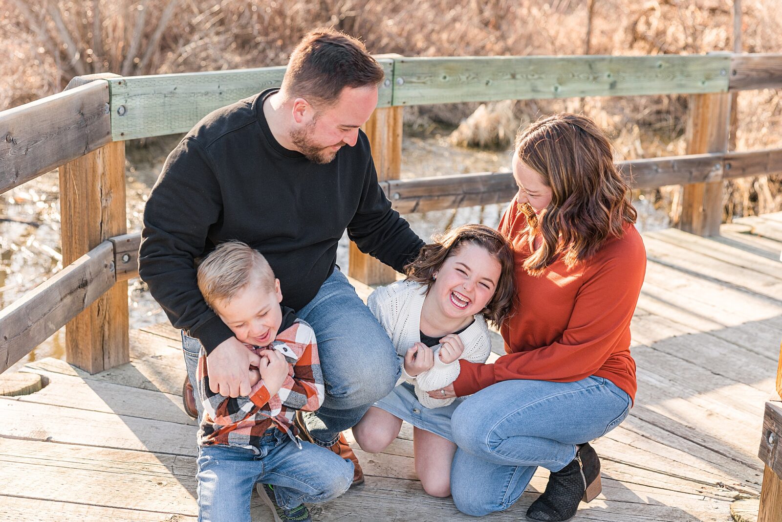 Moose Jaw Spring Family session on boardwalk laughing 