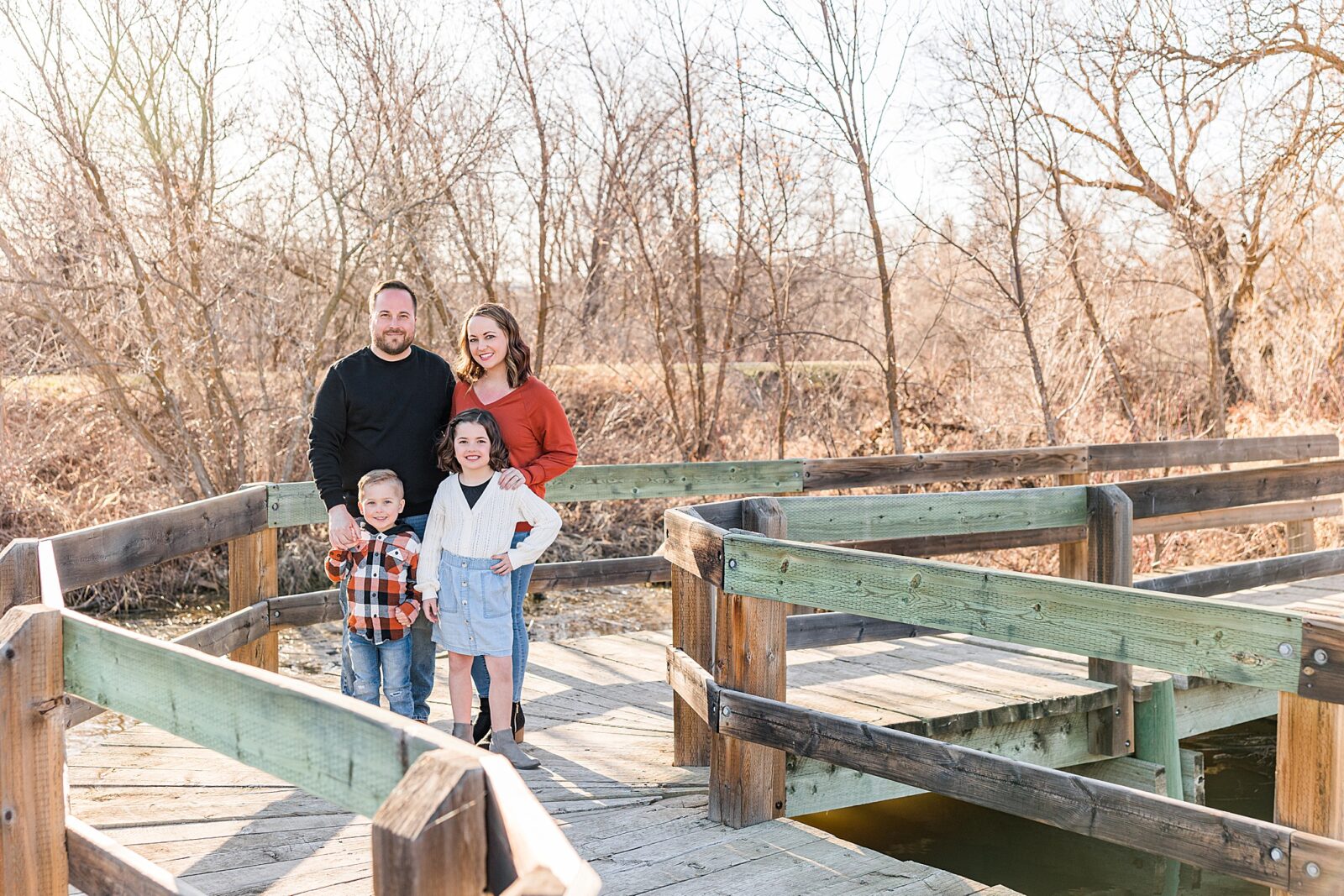 Moose Jaw Spring Family session on boardwalk looking at the camera